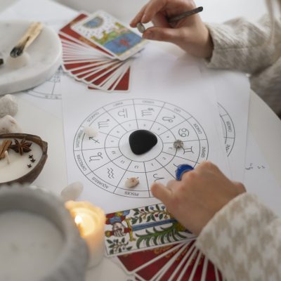 high-angle-woman-reading-tarot-home